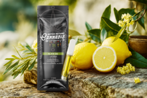 Alien OG vape cartridge and branded packaging from Native Nations Cannabis displayed next to fresh lemons and lemon blossoms on a rustic wooden surface.